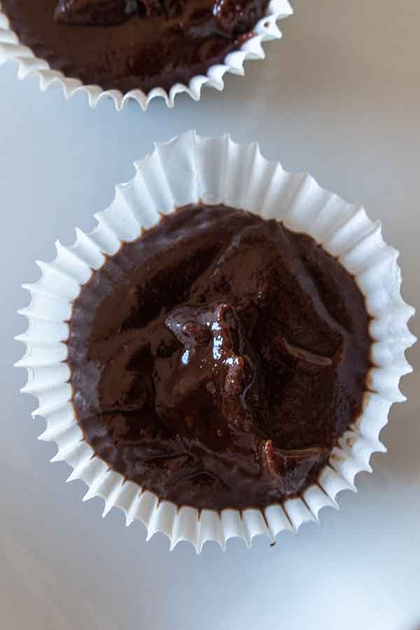 chocolate sauce in mini paper muffin liners