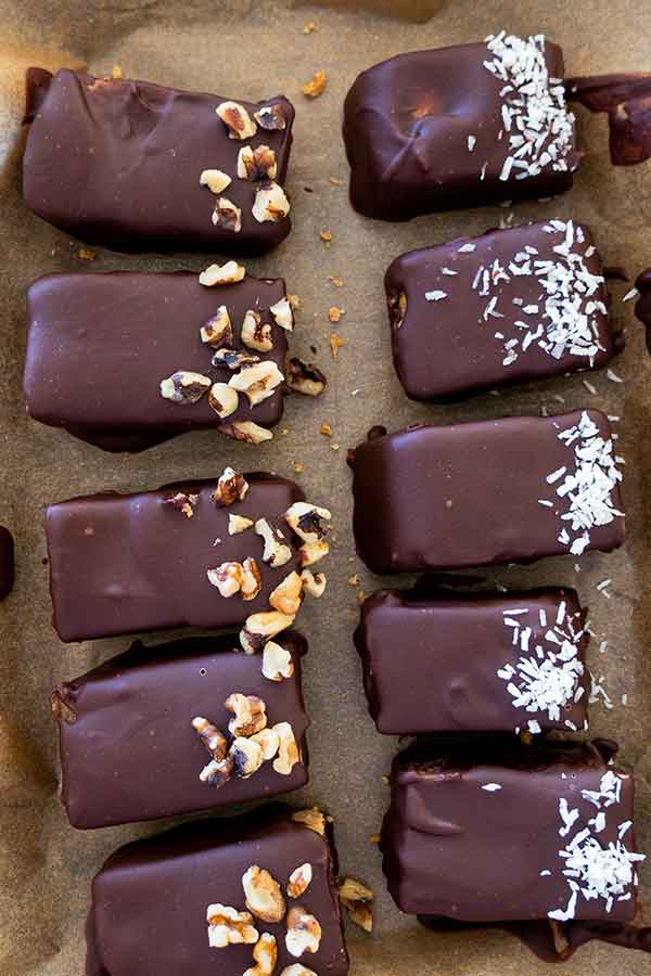 chocolate covered coconut bars on a tray