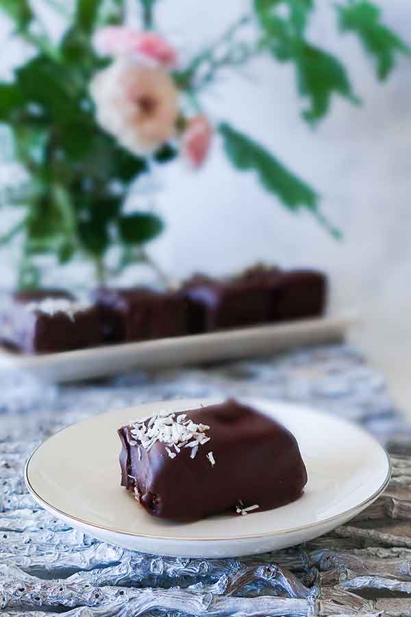chocolate covered coconut bar on a plate