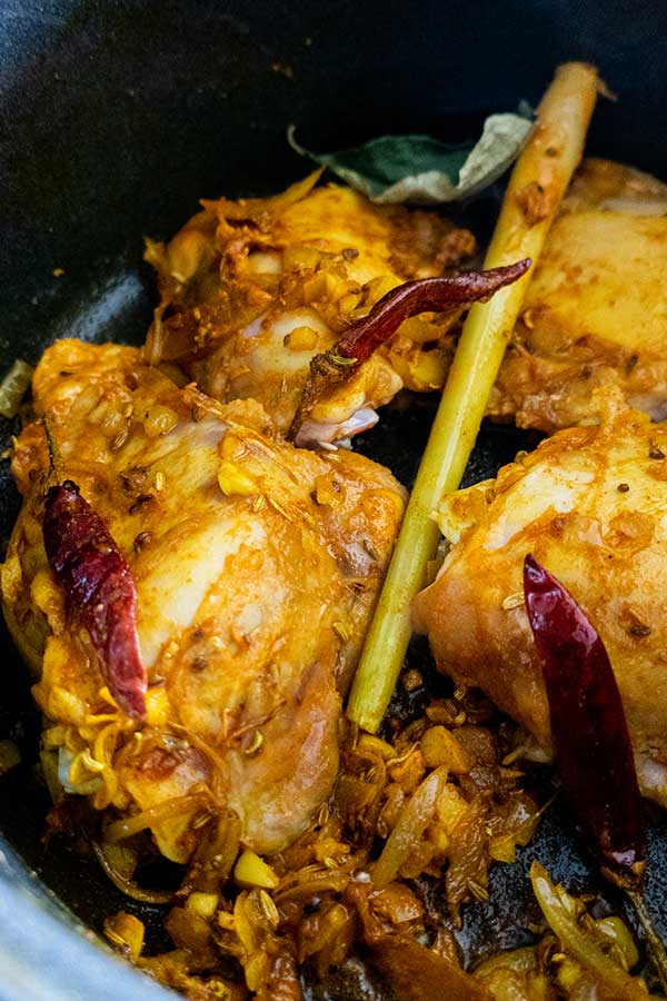 chicken coated with Malaysian spices in a pot