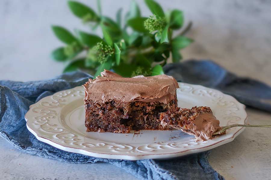 a slice of chocolate chip banana snack cake on a plate