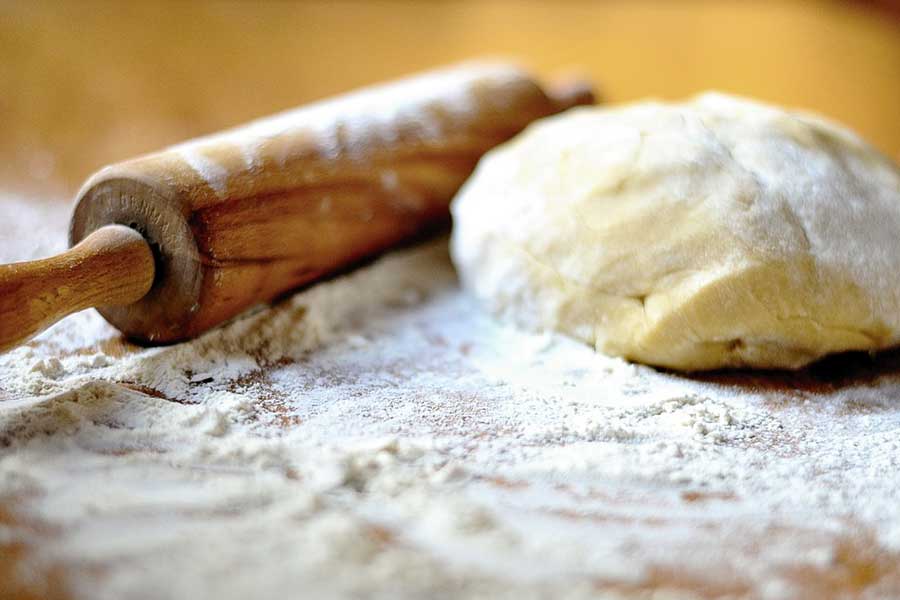 bread dough and rolling pin