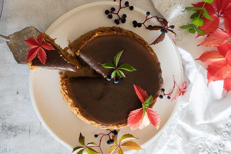 salted caramel pumpkin cheesecake on a dessert platter, gluten free