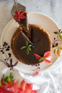 salted caramel pumpkin cheesecake on a dessert platter, gluten free