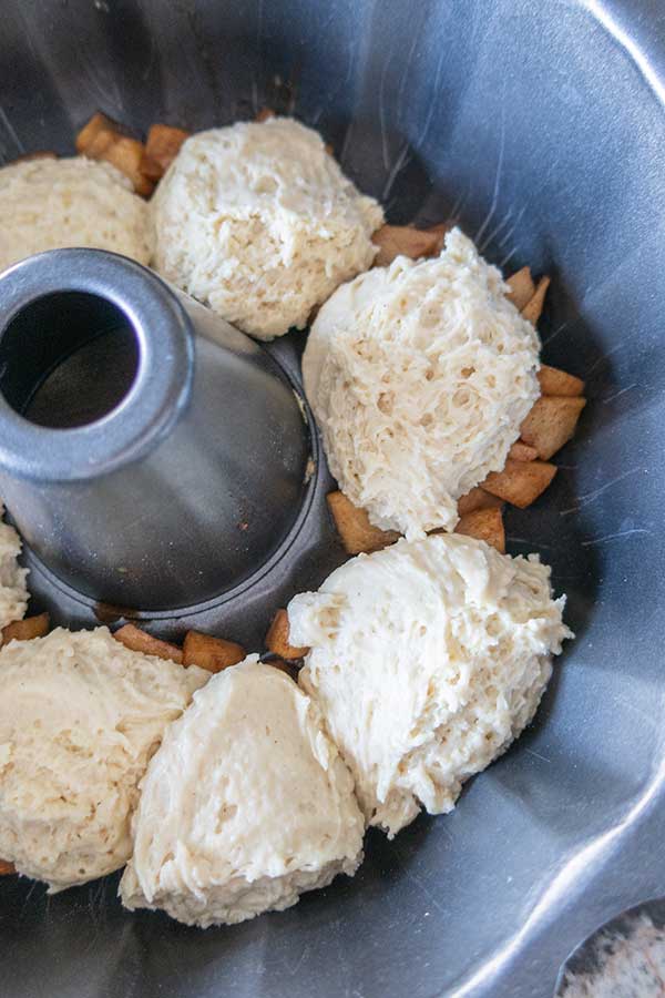 dollops of batter in a bundt pan