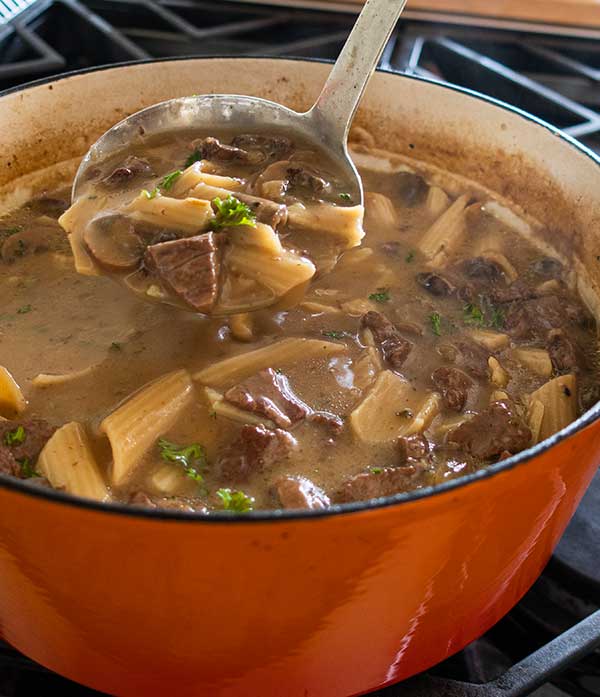 beef stroganoff soup in a Dutch oven
