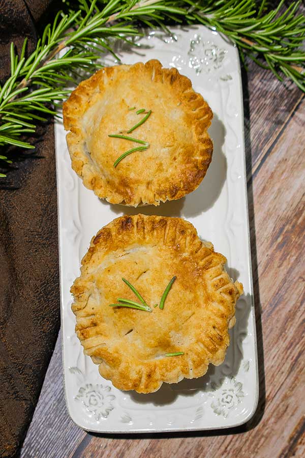 2 baked tourtieres on a plate