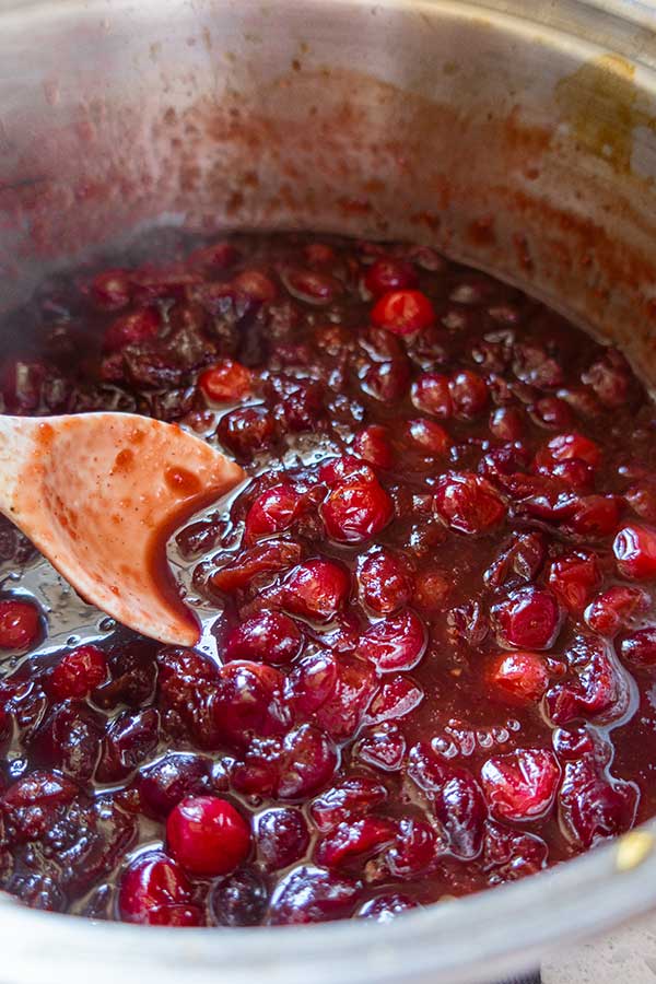 cranberry sauce simmering in a saucepan