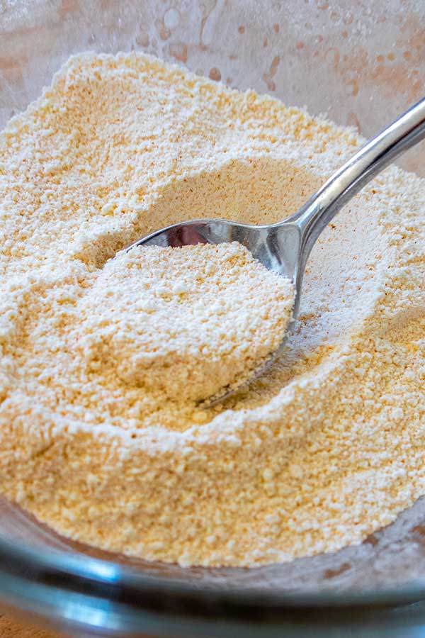 custard powder in a bowl with a spoon