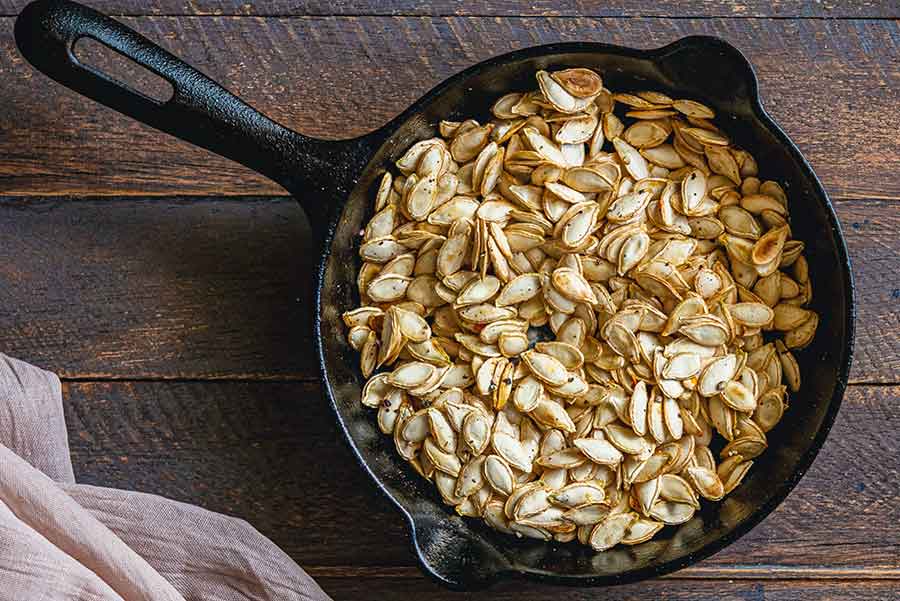 roasted pumpkin seeds in a skillet