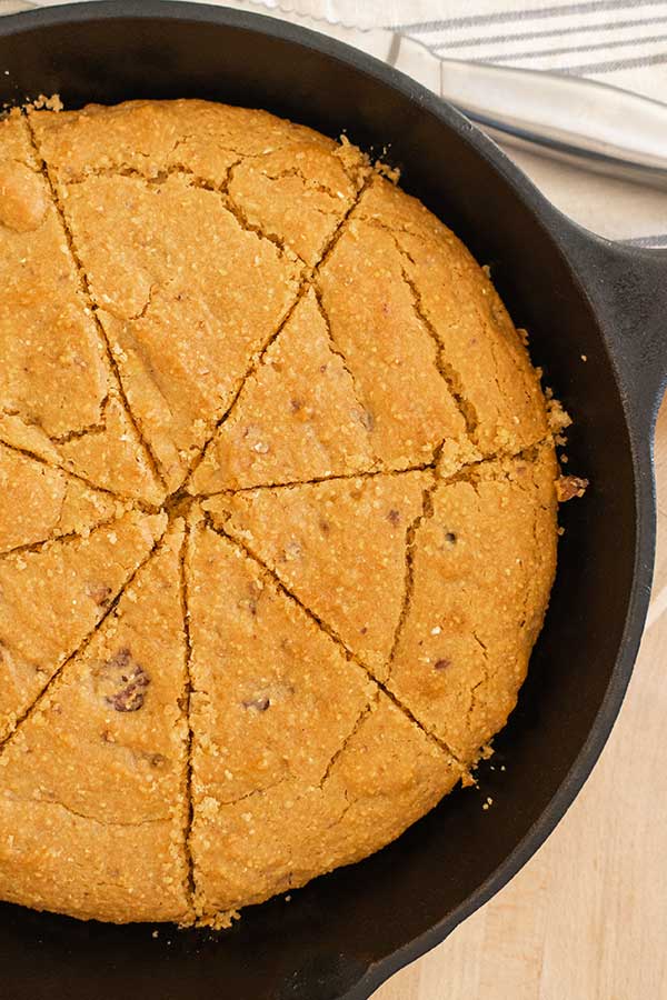 overview of sliced vegan cornbread in a skillet