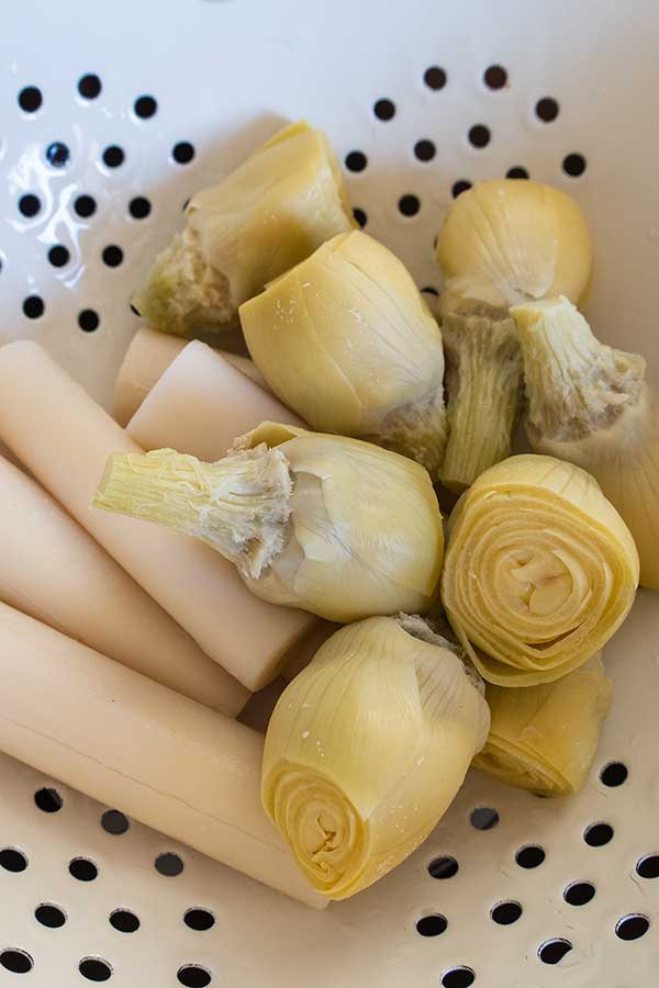 artichokes and hearts of palm in a colander