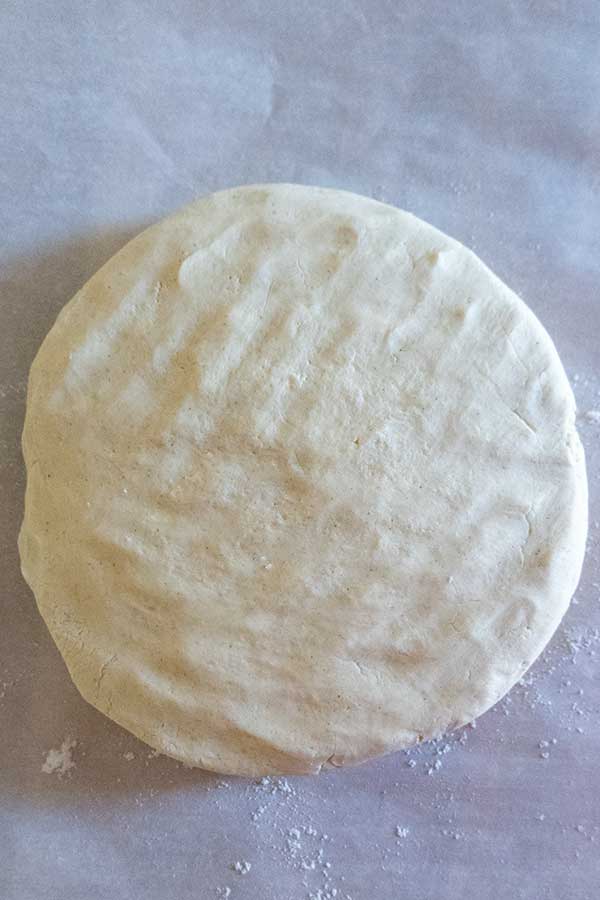 linzer cookie dough shaped into a disk