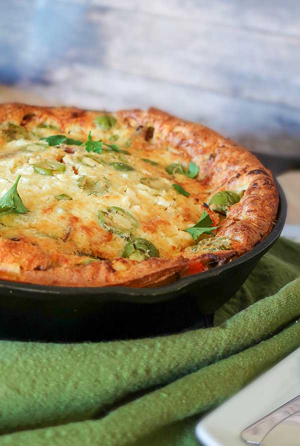 baked gluten free savory dutch baby in a cast iron skillet