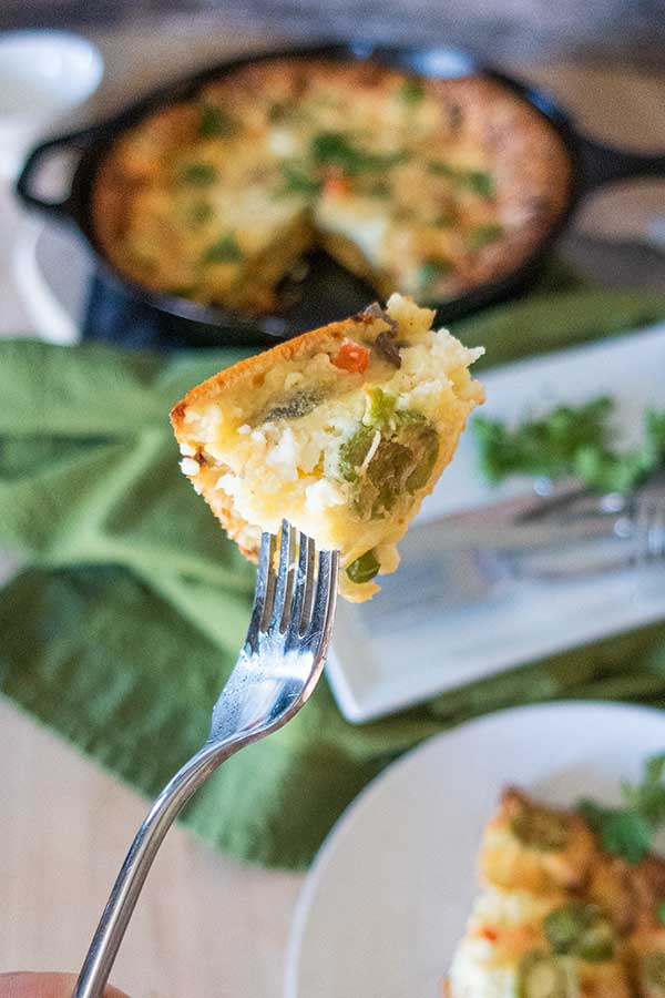 piece of savory dutch baby on a fork