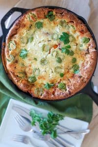 overview of savory dutch baby in a cast iron skillet