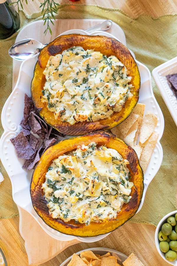 overview of two kabocha halves stuffed with hot dip