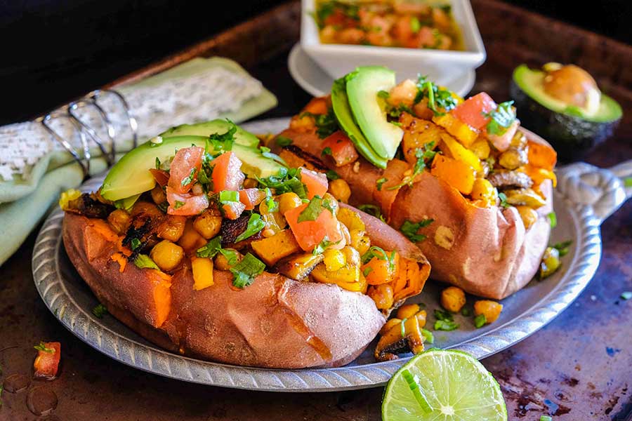 overview of stuffed baked yams on a plate