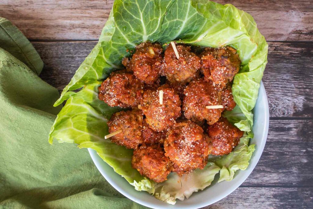 overview of gluten free baked meatballs in a cabbage leaf