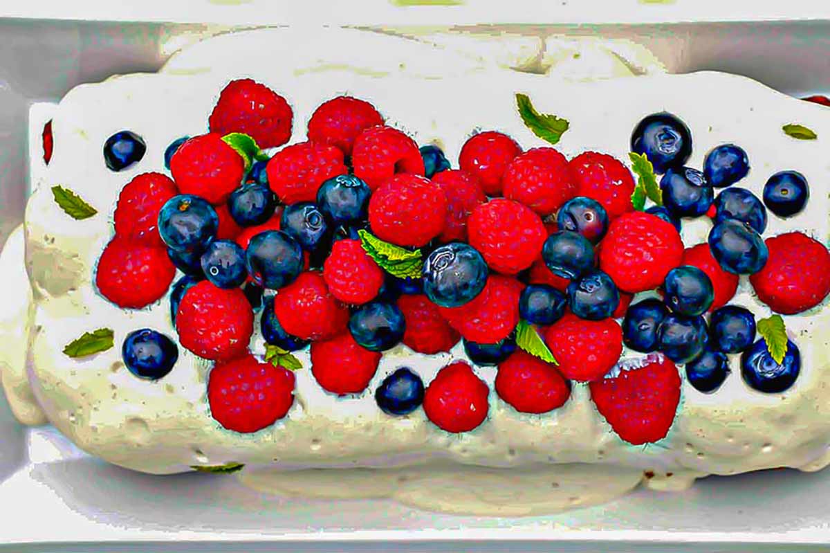 overview of berry shortcake topped with fresh berries, egg free