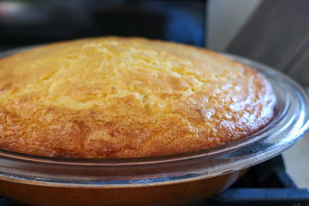 baked coconut lemon custard pie in a pie dish