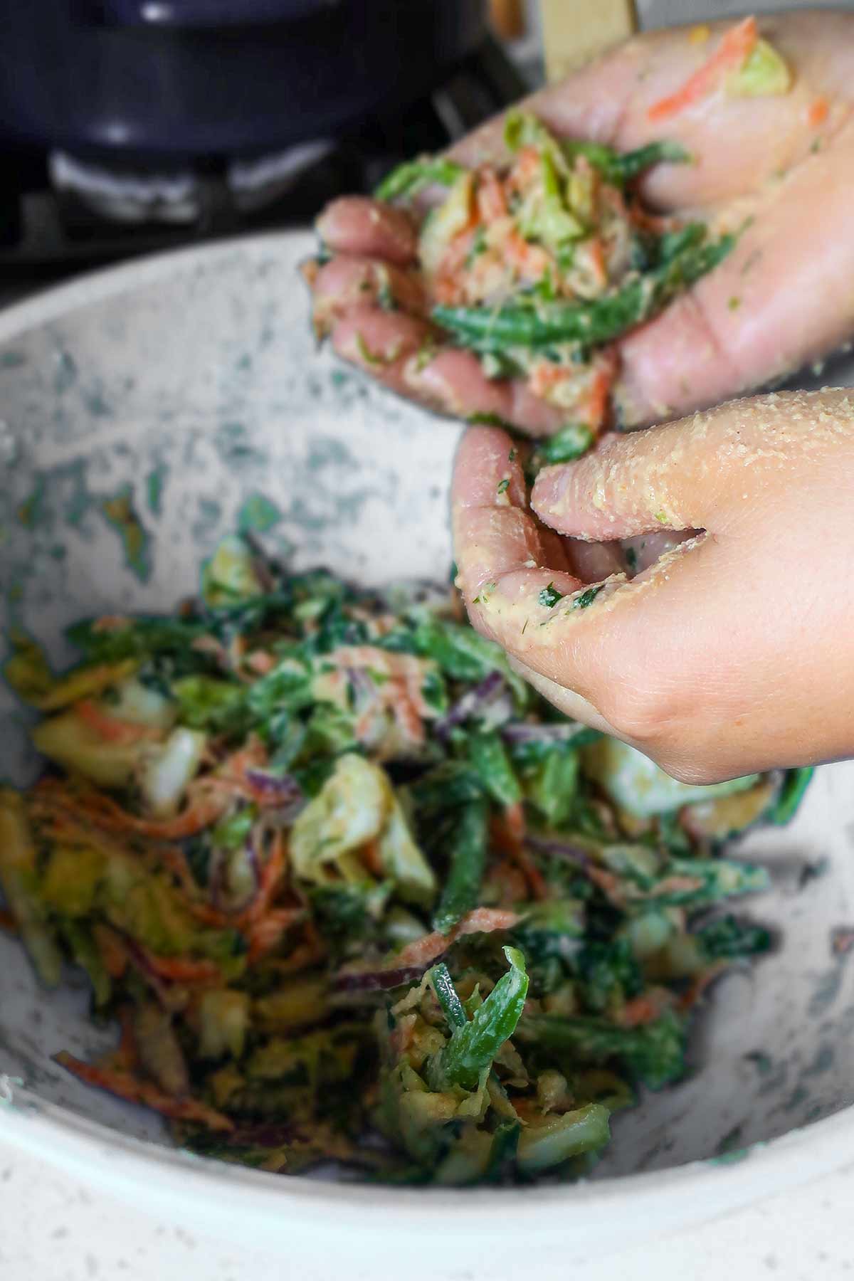 shaping pakora dough using hands