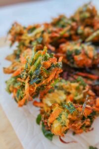 gluten free vegetable pakoras on a paper towel