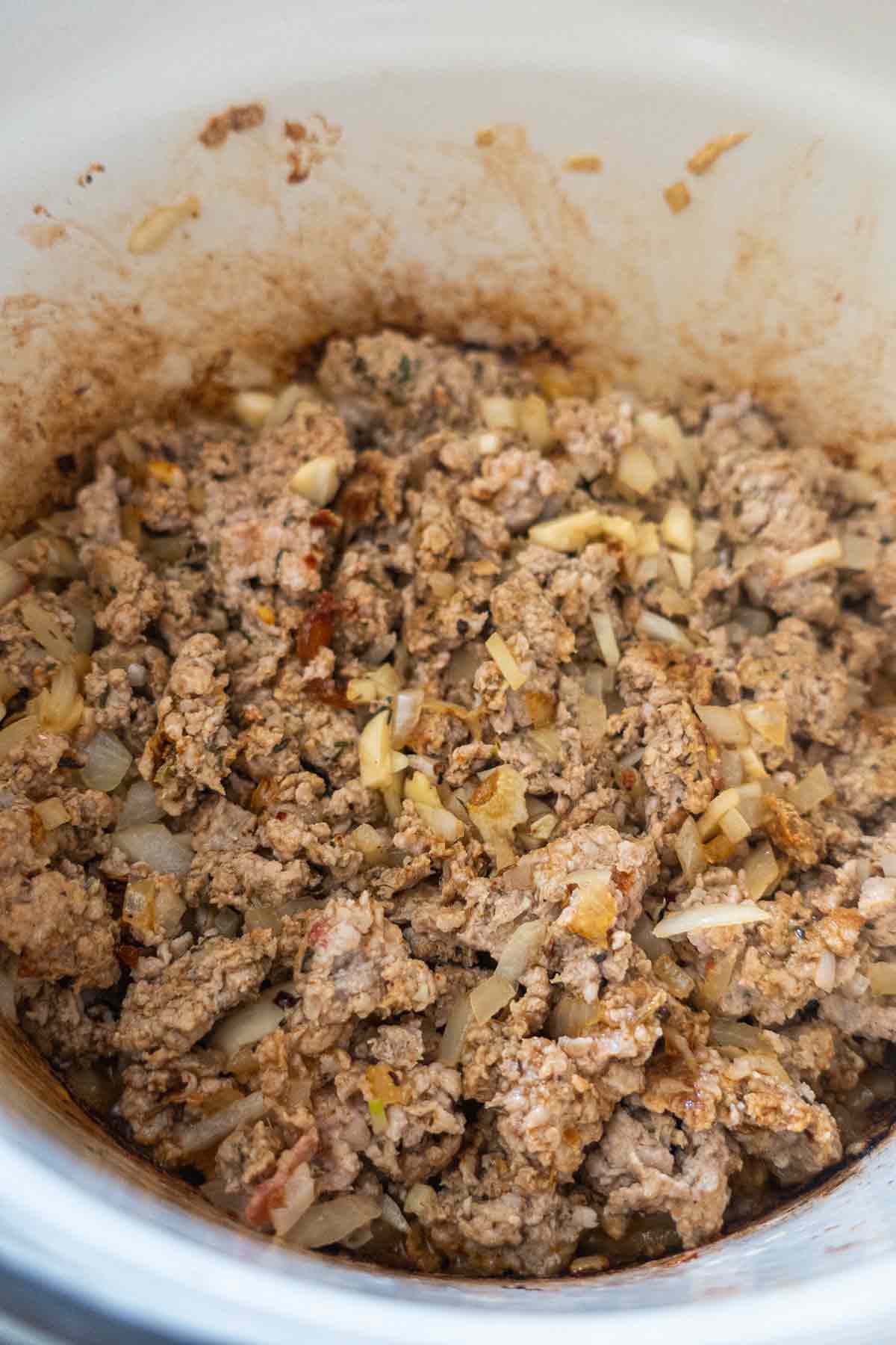 browned pork with spices in a Dutch oven 