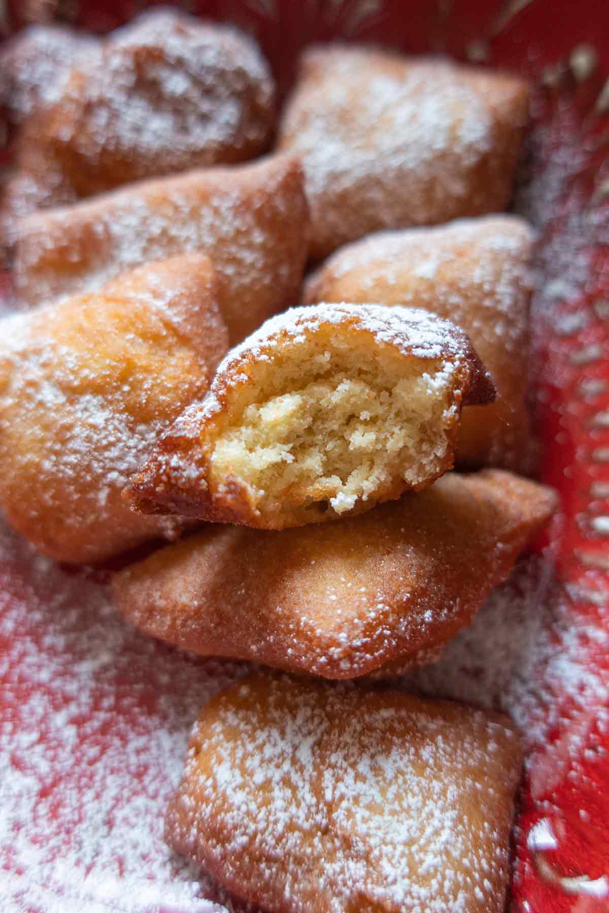 oveview of small donuts dusted with powdered sugar
