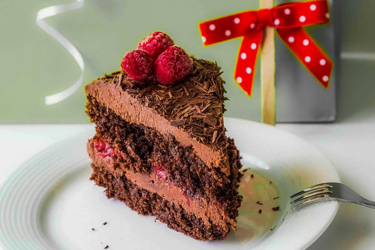 slice of chocolate vegan cake on a plate for Valentines