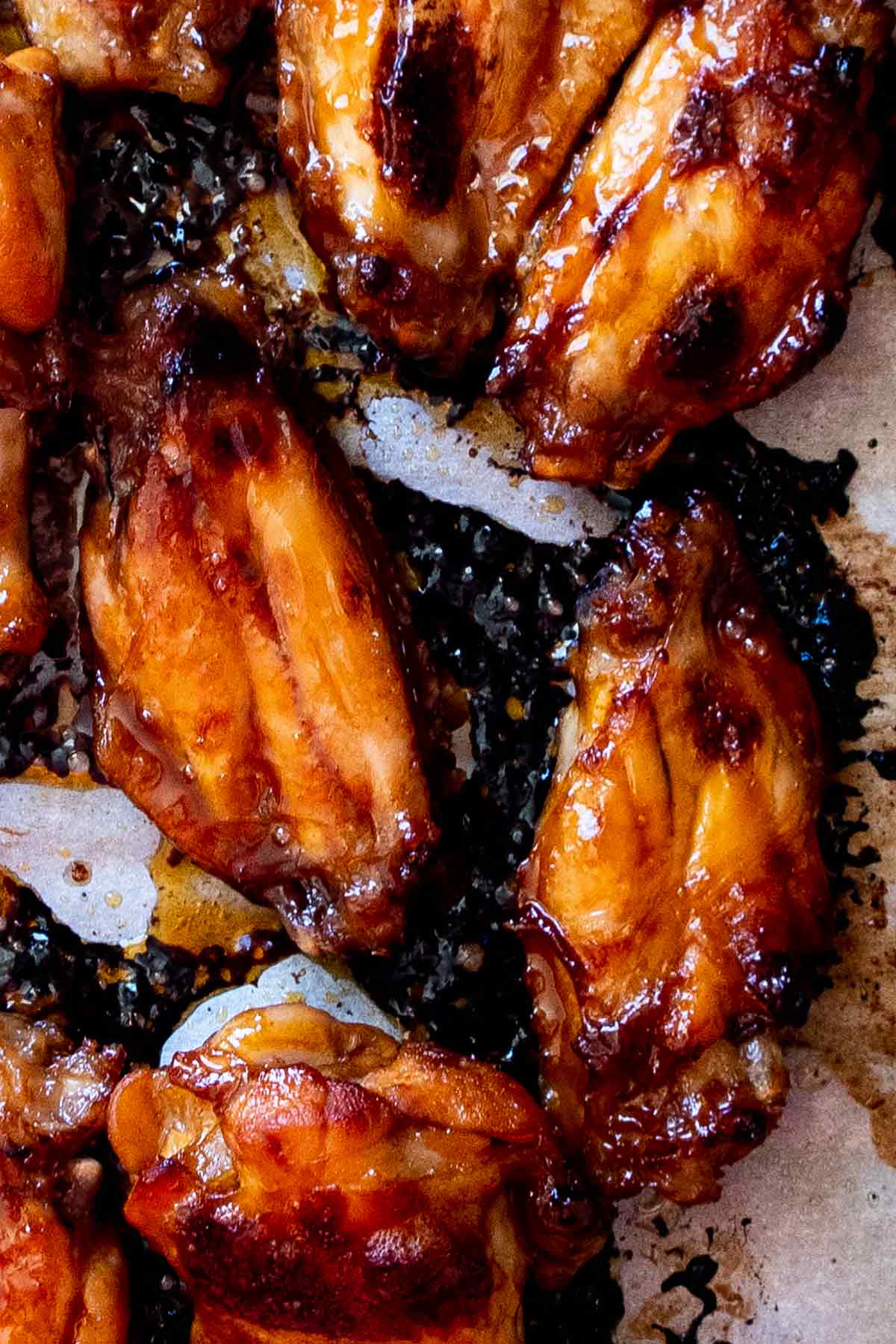 baked korean chiicken wings on a baking sheet