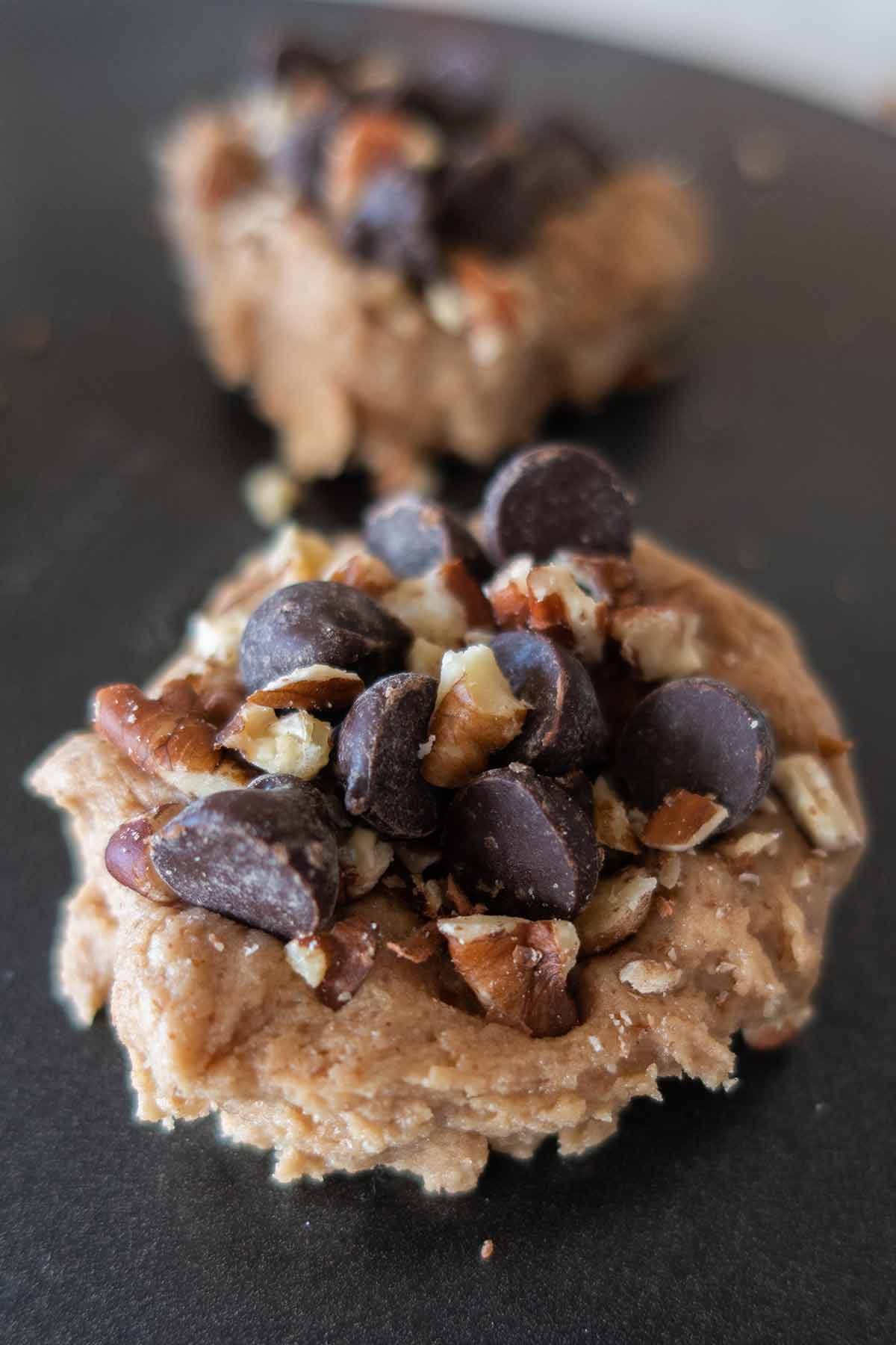 raw chocolate chip mocha cookie on a cookie sheet