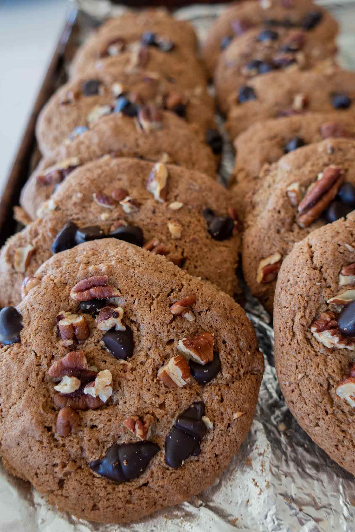 stacked cookies in two rows on a cookie sheet