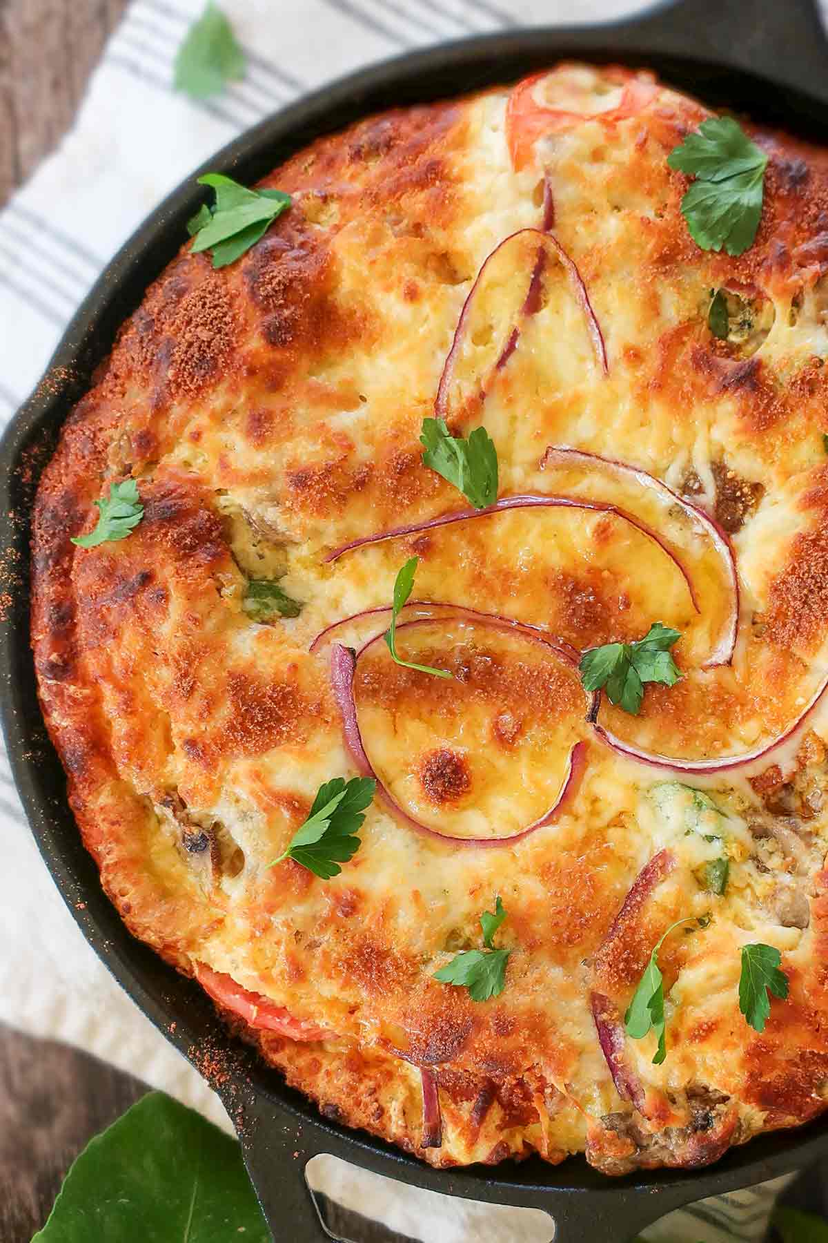 close up of a baked Italian pie in a skillet