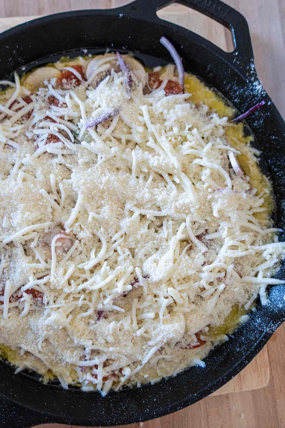 unbaked pizza pie in a skillet