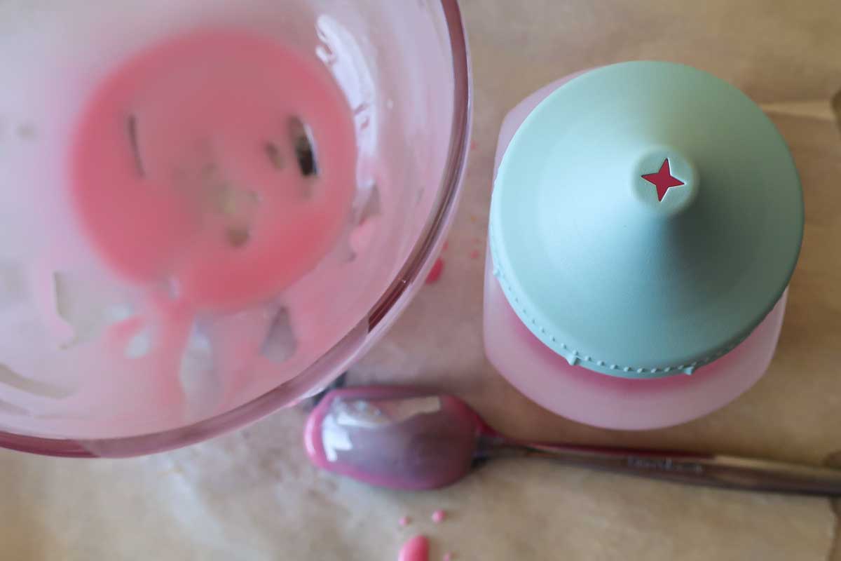 blueberry icing with a squeeze bottle and a spoon