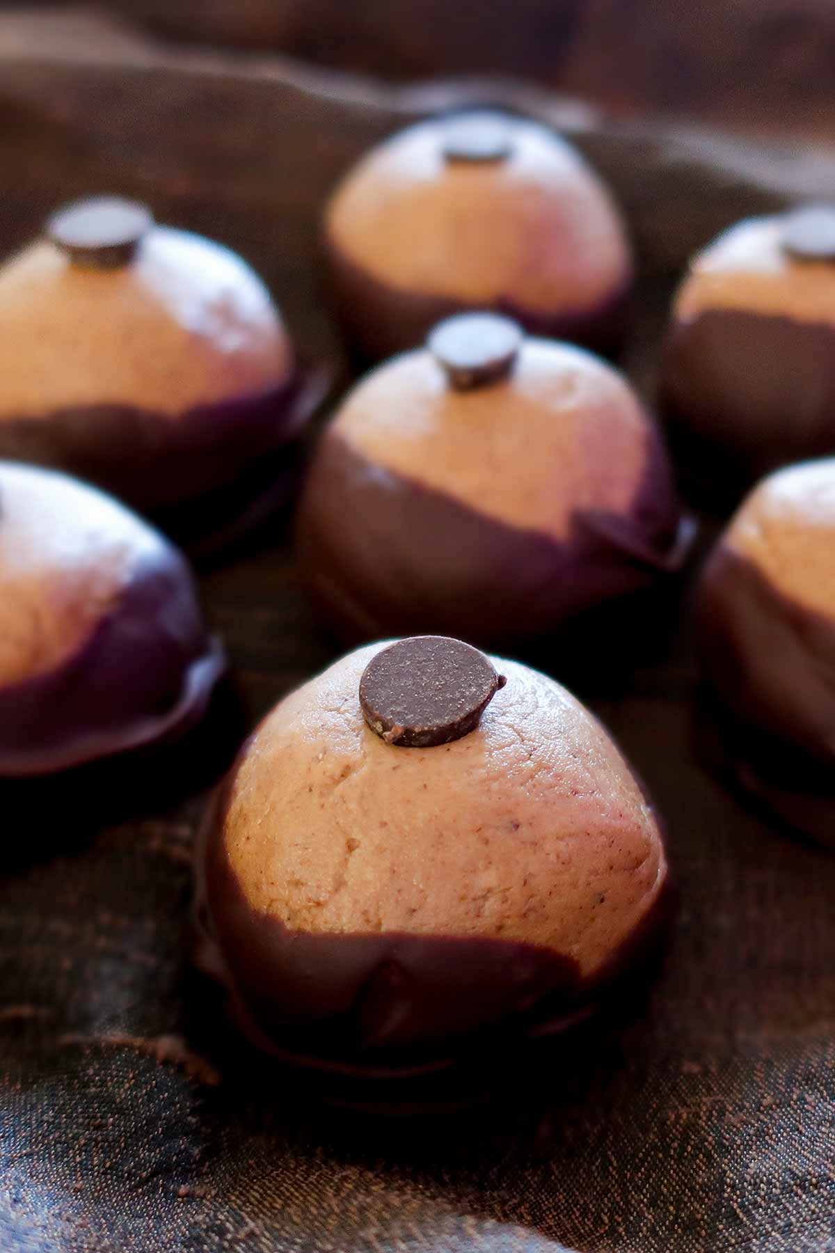 almond butter buckeye cookies topped with chocolate chip