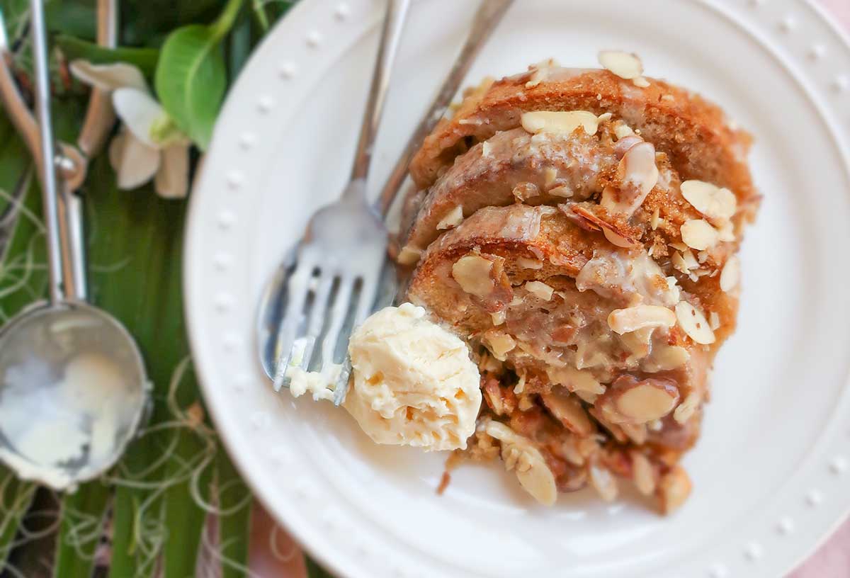 slice of French toast casserole on a plate with ice cream