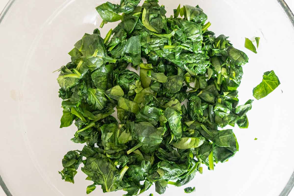 steamed chopped spinach in a glass bowl