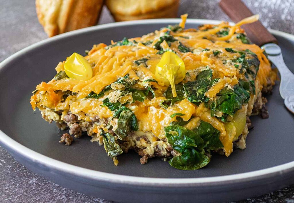 john wayne casserole with spinach on a plate