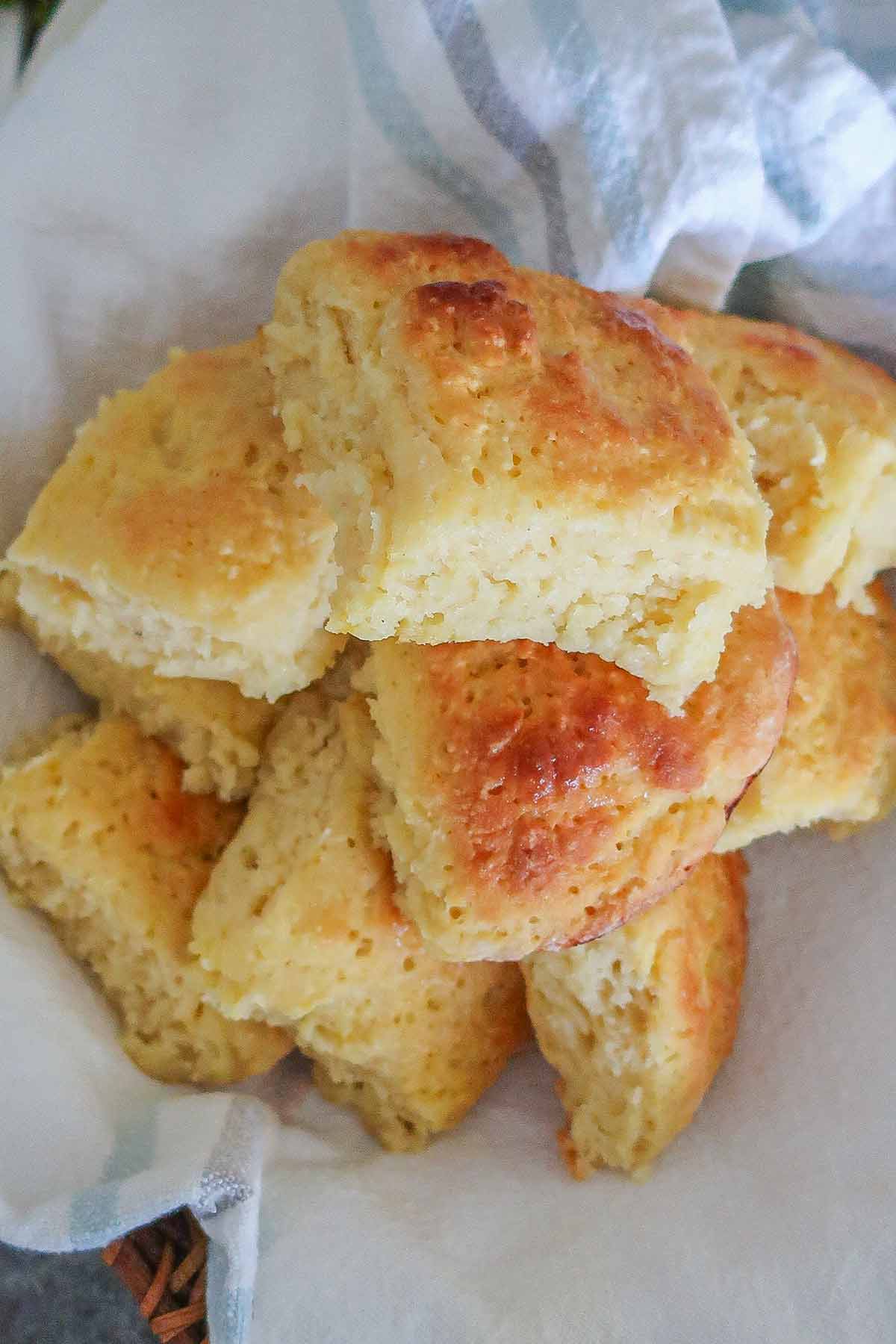 overview of stacked milk rolls in a kitchen towel