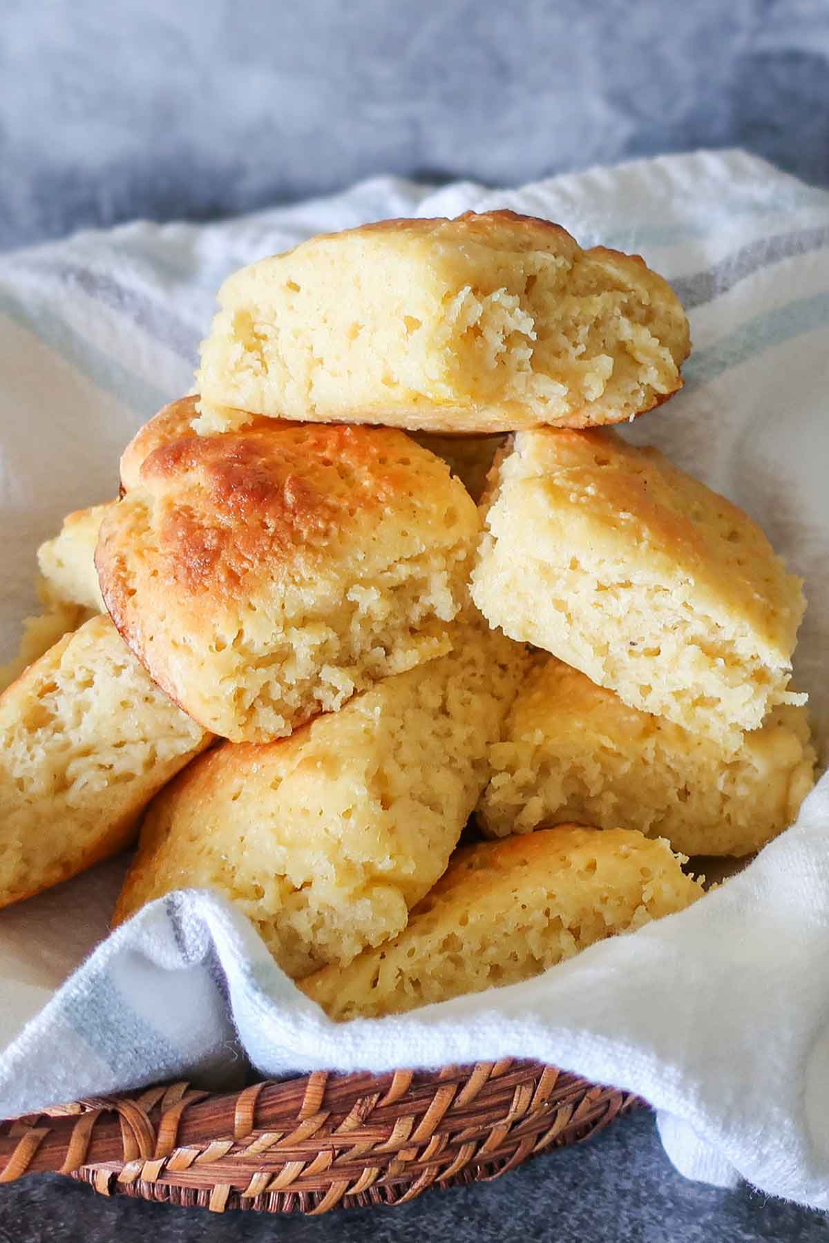 stacked gluten free milk rolls in a basket