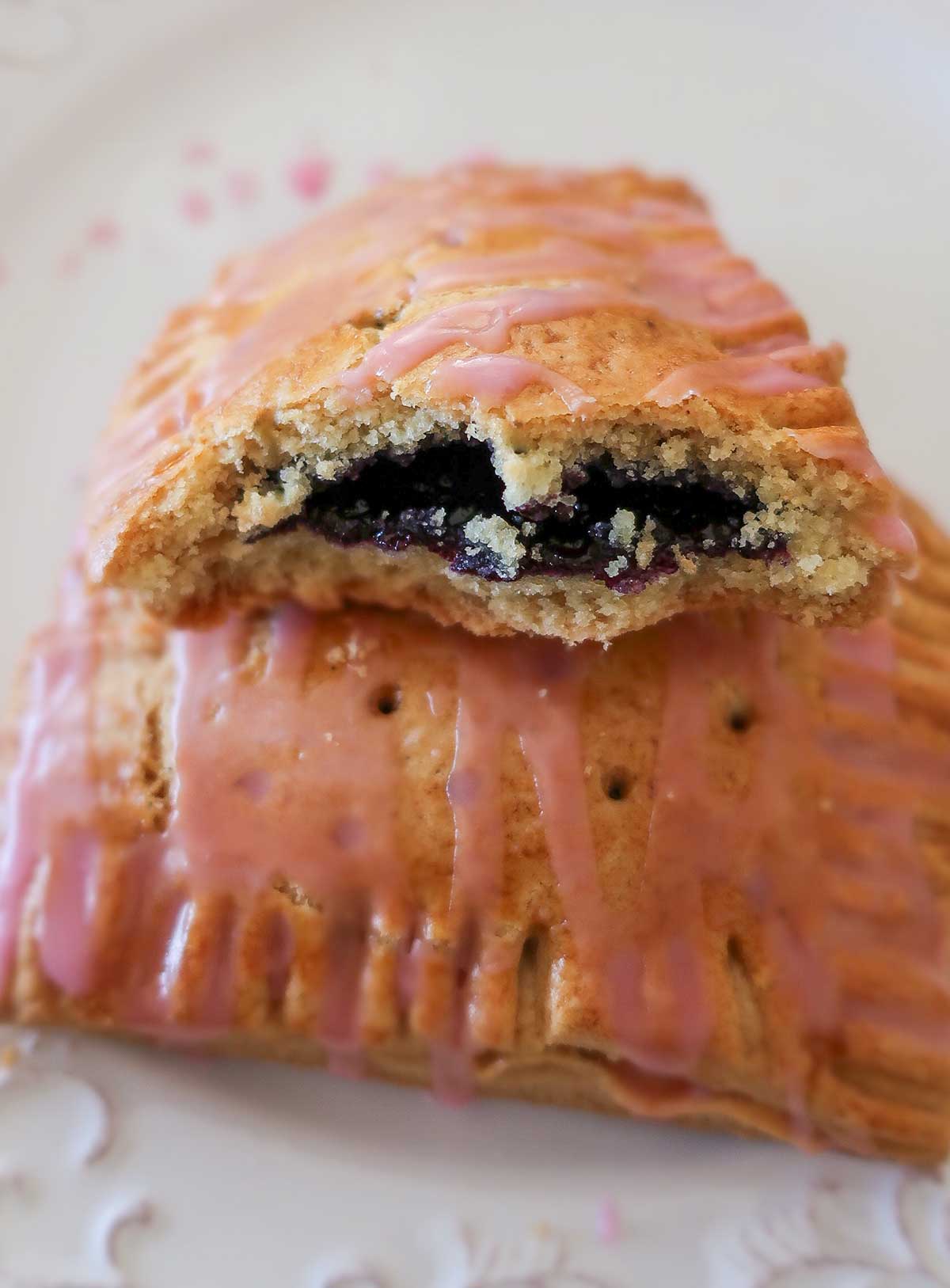 close up of gluten free pop tart exposing blueberry filling