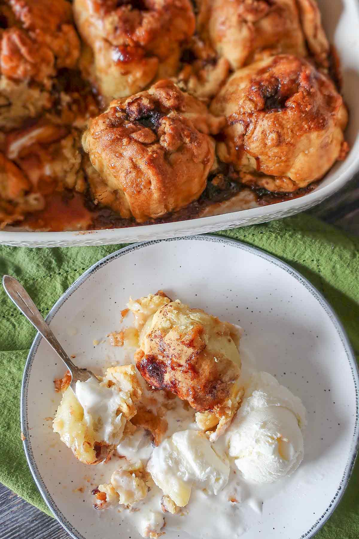 half eaten apple dessert on a plate with vanilla ice cream