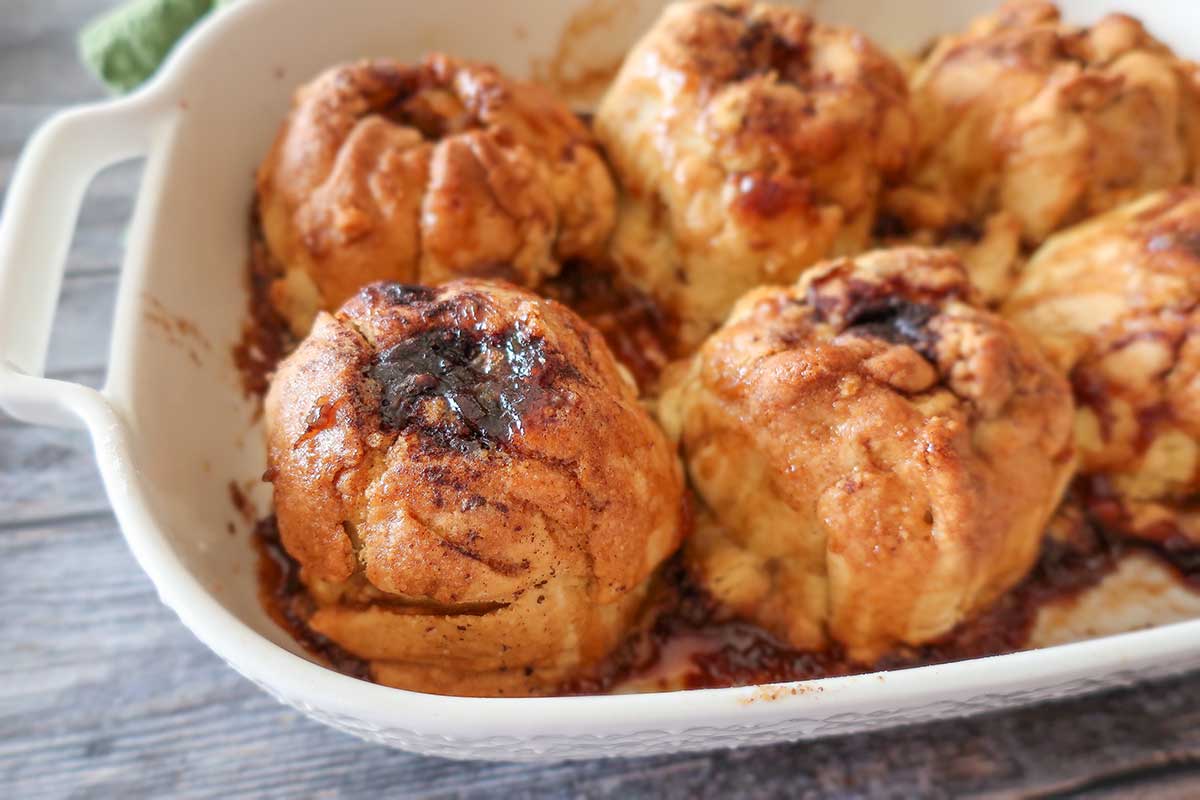 baked old-fashioned apple dumplings in a baking dish