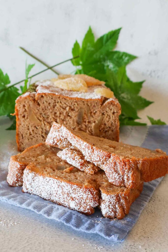 two slices of banana ginger bread dusted with powdered sugar