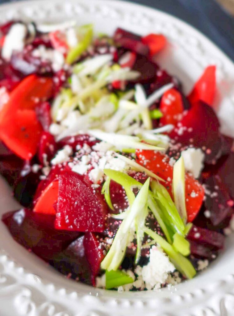 close up of beet and carrot salad with feta cheese