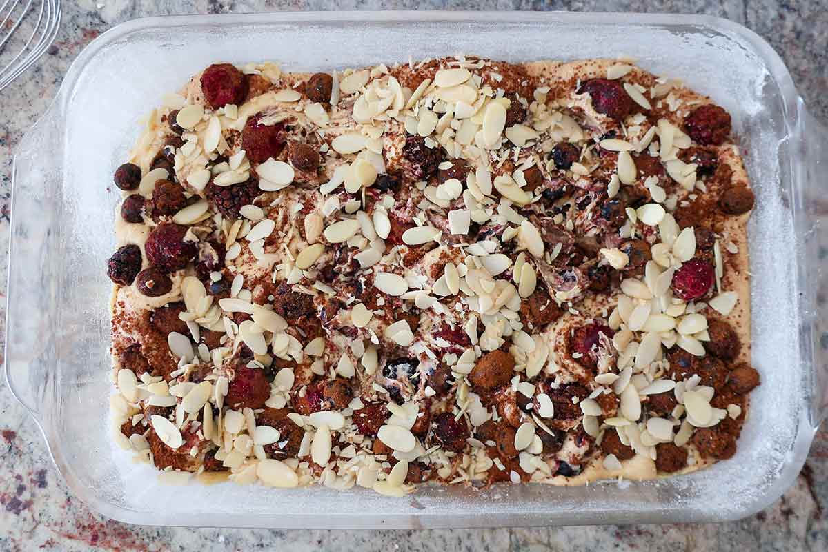 fresh berry snacking cake in a baking dish before it is baked