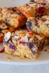 a slice of gluten free fresh berry snacking cake