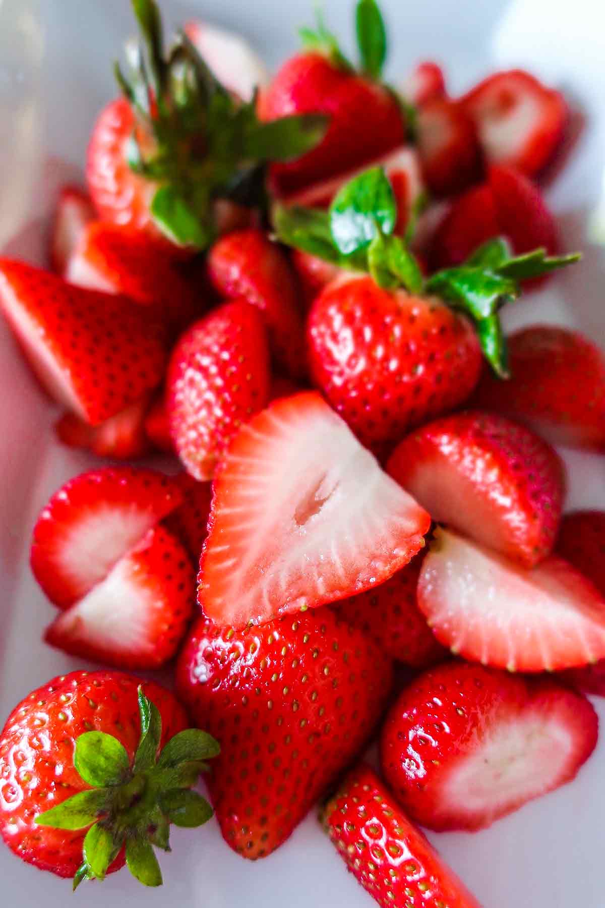 fresh sliced strawberries on a plate